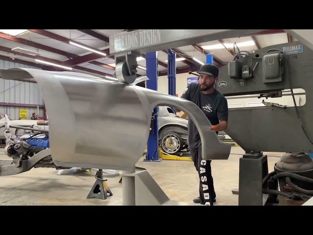 Metal shaping a Ferrari quarter panel on the English Wheel here at Casados Design