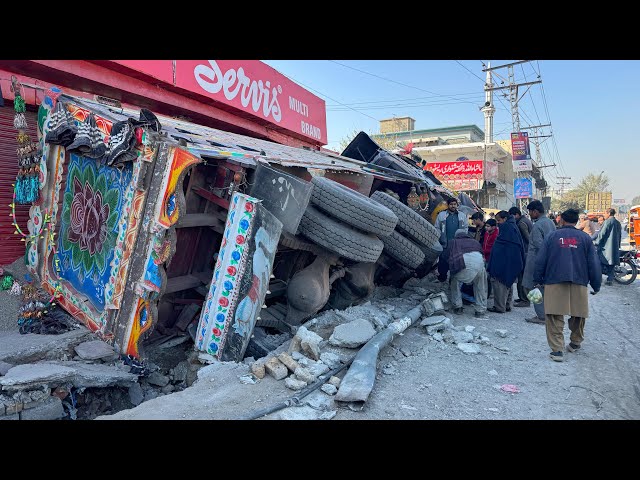 Out of Control! Loaded Truck Flips and Destroys Roadside Shops