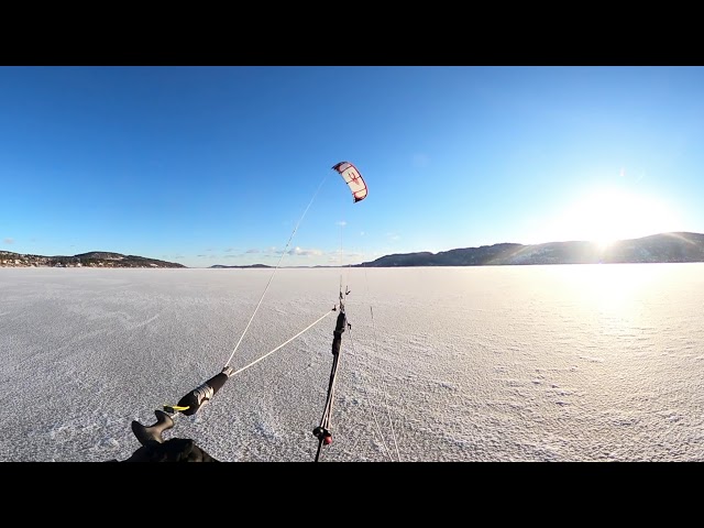 Kiting on ice in Sandebukt in Norway.