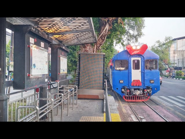 ONLY IN SOLO, Waiting at a City Bus Stop But a Train Goes By instead.