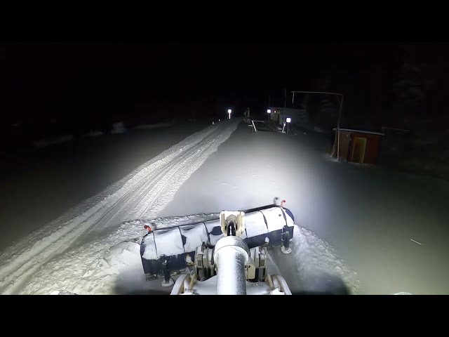 cleaning up after a Swedish snowstorm  Caterpillar 972M XE Wheel Loader plow snow with diagonal plow