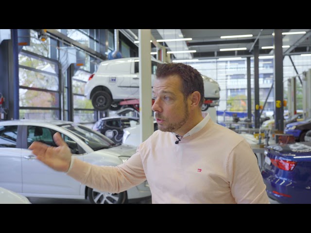 Compact folding door in automotive practice room at ENKA campus in Arnhem, The Netherlands