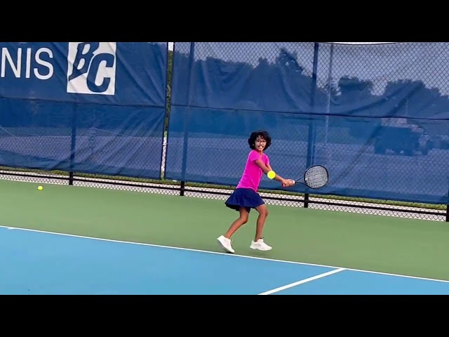 9 years old playing tennis