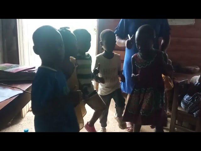 Nursery School Children Practice Marching Song For Their Graduation
