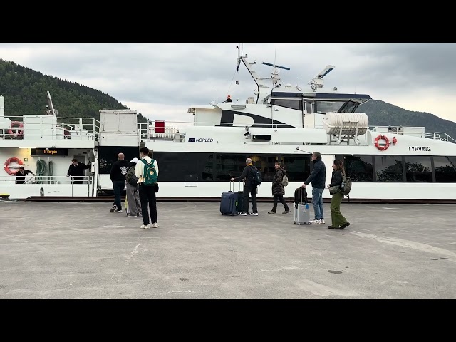 Norled express ferry pulling up to Balestrand pier