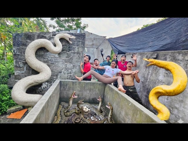 The brave soldier uses a snake detector to locate the giant python's nest.