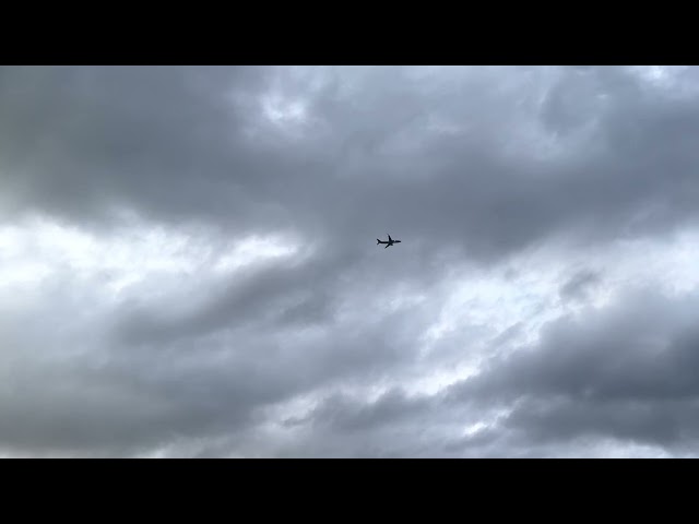 COMMERCIAL AIRCRAFT IN FLIGHT CLOUDY DAY B-ROLL B-REEL B ROLL