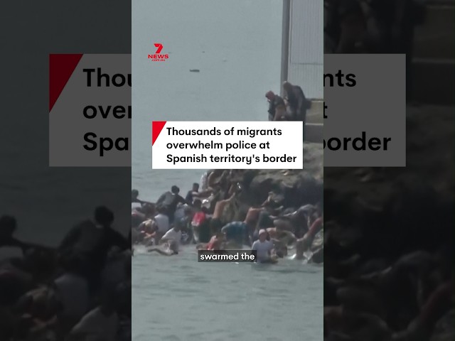 Thousands of migrants overwhelm police at Spanish territory's border