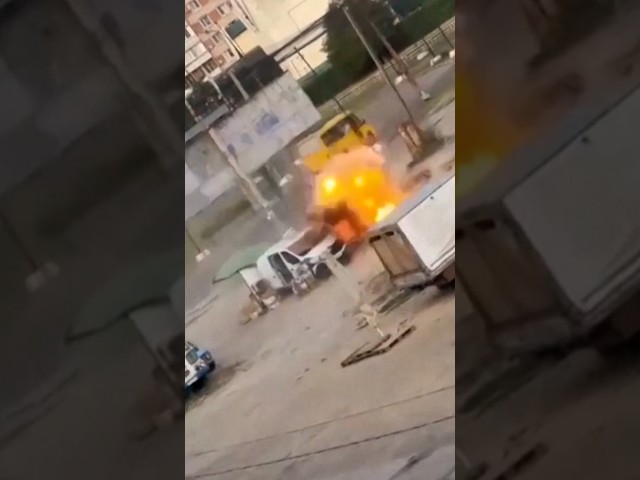 Video shows drone chasing man round van before exploding