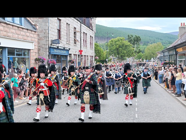 Massed Pipes & Drums lead the Royal Guard and Highlanders march to the 2026 Ballater Highland Games