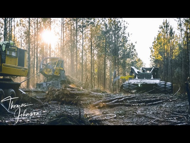 John Deere 748L Skidder Working In The Mud
