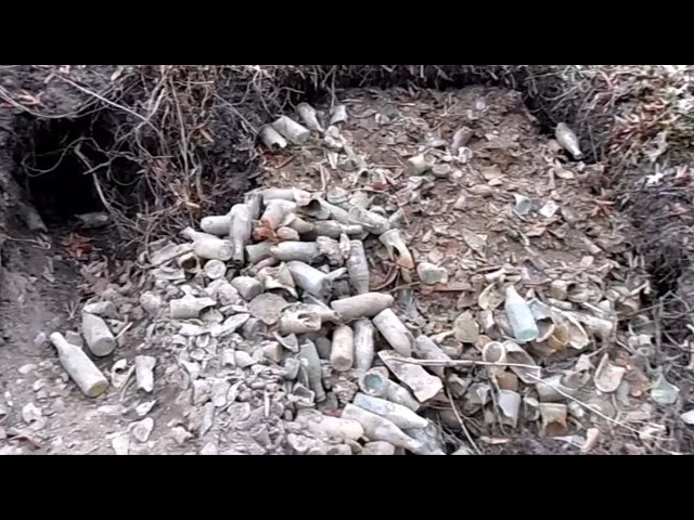 Mr. Bottles Digging a Dump full of Antique Soda Bottles.