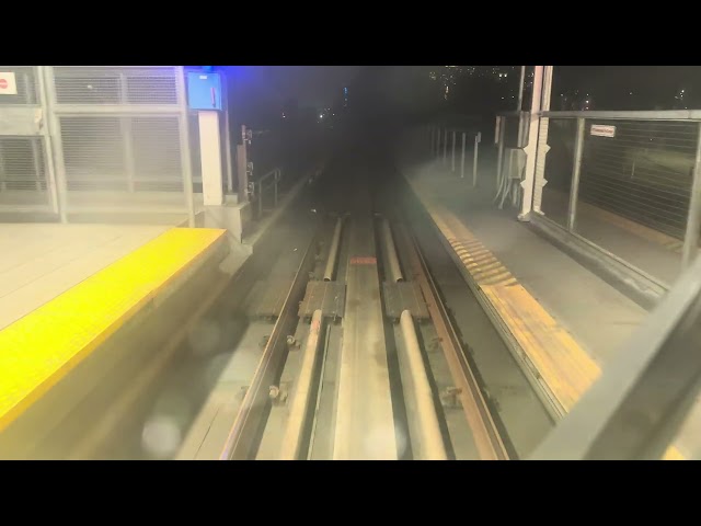 Vancouver sky train nighttime backwards like a roller coaster ride