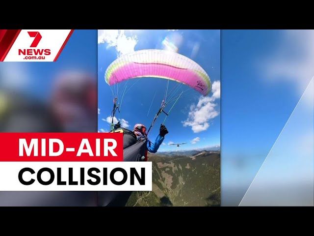 Paraglider survives mid-air collision in Austrian Alps | 7NEWS