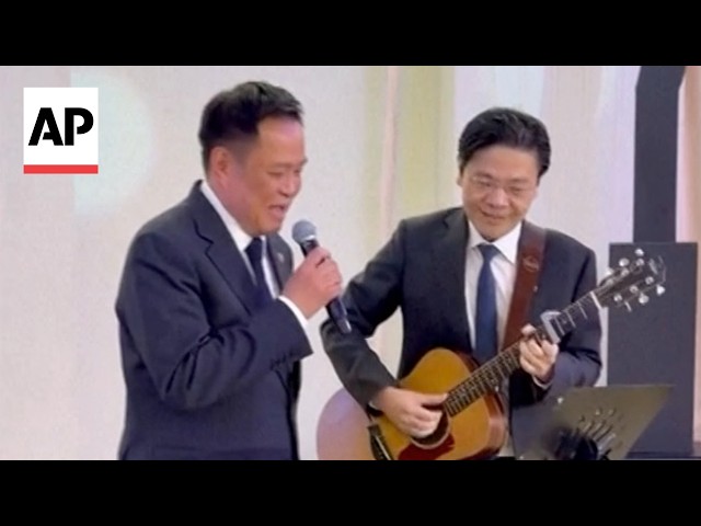Thailand and Singapore prime ministers perform The Beatles' 'Let It Be' in Bangkok