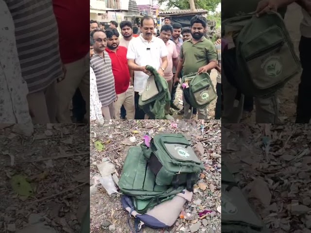 Exposing the state of the Education Department under the coalition government by showing torn bag...
