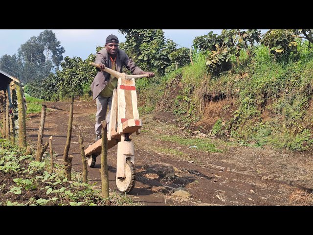 Riding a Handcrafted Wooden Scooter to Transport Loads in Congo