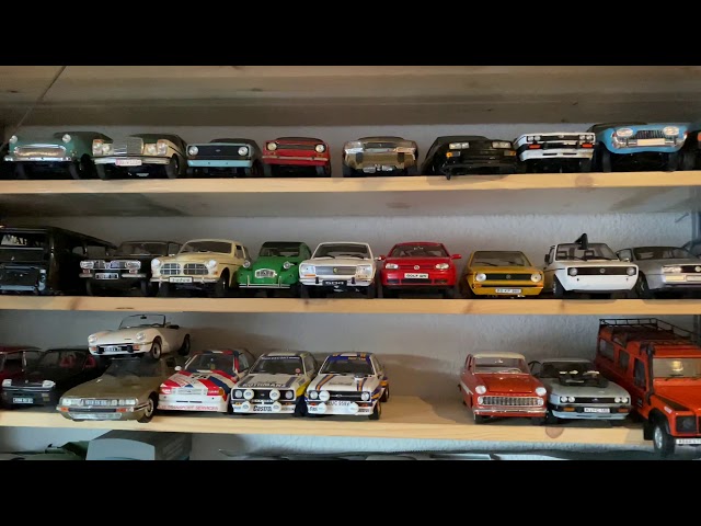 When the dealer makes a house call. 1:18 model cars. Arrival of new junk cars.