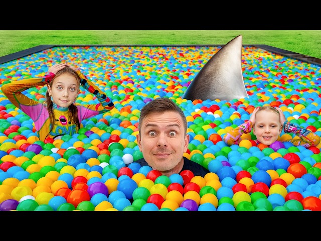 Fun time by the pool! – Alex and the toy shark in the pool