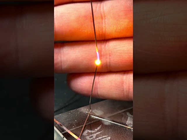 Plasma Ball Spins on the Tip of a Bent Paper Clip