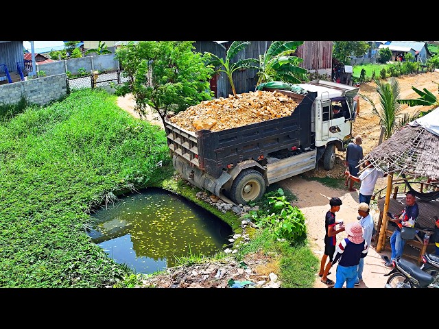 O.M.G incredible Tank full project lanfill , truck nissan unloading soil , Dozer D20A push soil rock