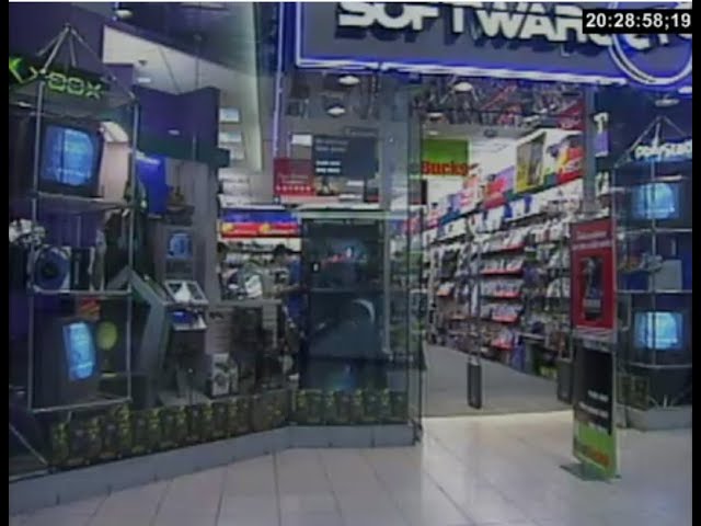 Browsing video games at a Software Etc. store in 2002