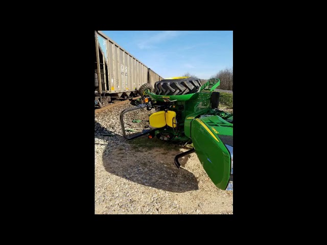 train hits tractor