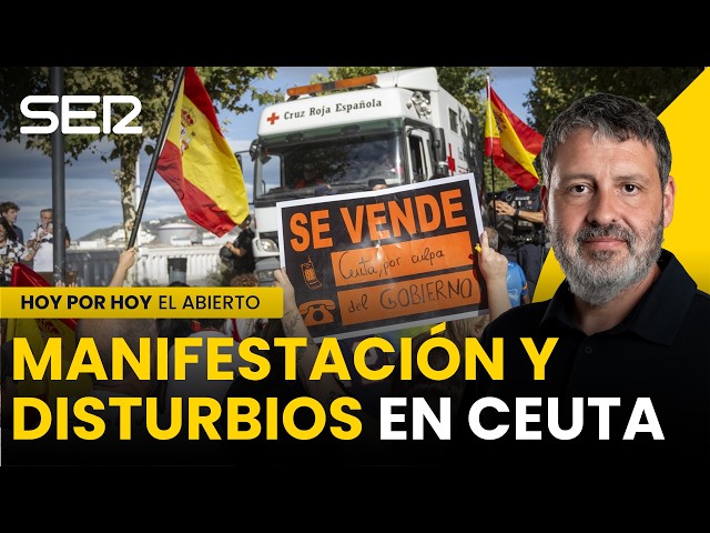 Un GRUPO de MANIFESTANTES se SALTA el CORDÓN POLICIAL y QUEMA parte del CAMPAMENTO de MIGRANTES