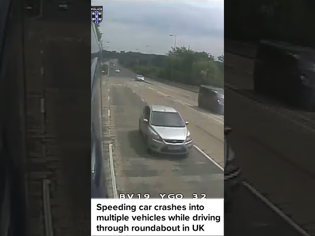 Speeding car crashes into multiple vehicles while driving through roundabout in UK