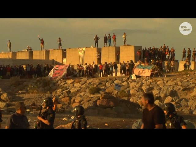 Ceuta residents destroy migrant beach camp as tensions rise in Spain