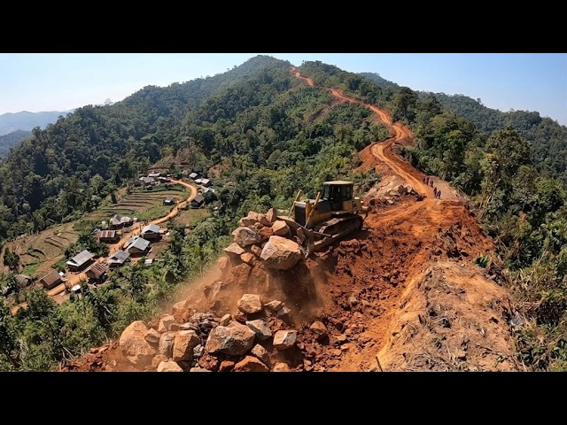 Heavy Machinery in Action: Dangerous Mountain Road Opening Operation.
