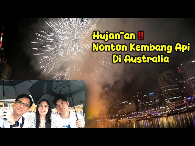 Watching Fireworks in The Rain at Sydney Darling Harbour, Australia