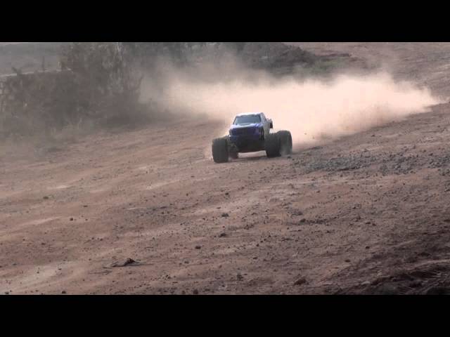 RedCat Rampage XT 1/5th Scale Gasoline RC 4WD Monster truck tearing the Dirt road.