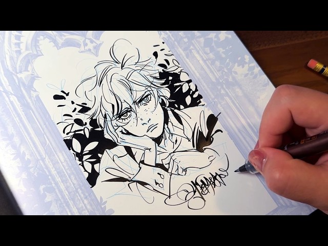 Drawing and signing inked sketches in my comic!