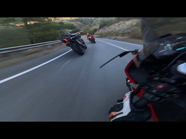 BMW s1000rr chasing an Aprilia RSV4, a Yamaha R1 and a Triumph Street Triple 765rs.