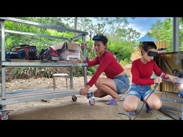 The girl creatively repairs and builds a trolley for carrying repair equipment