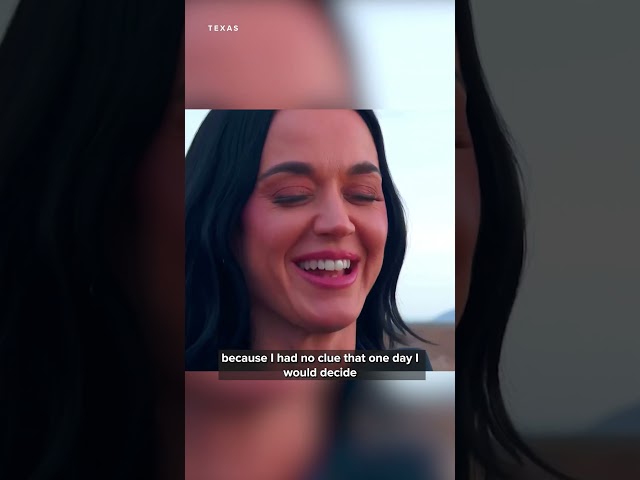 Katy Perry telling reporters what song she sang when they reached space