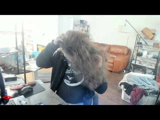 Combing my hair before taking a shower