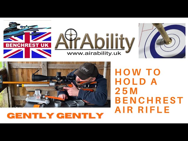55. Holding your 25m Benchrest Air Rifle.