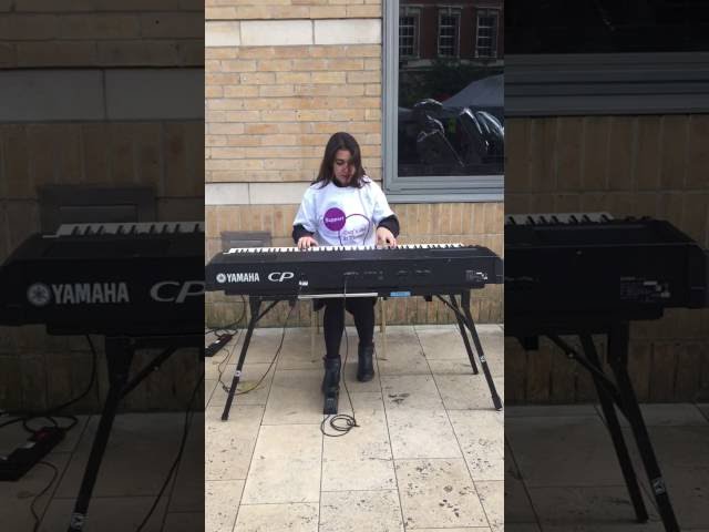 DLD College London student Dayana Chumburidze plays piano at Guy's Urban Adventure
