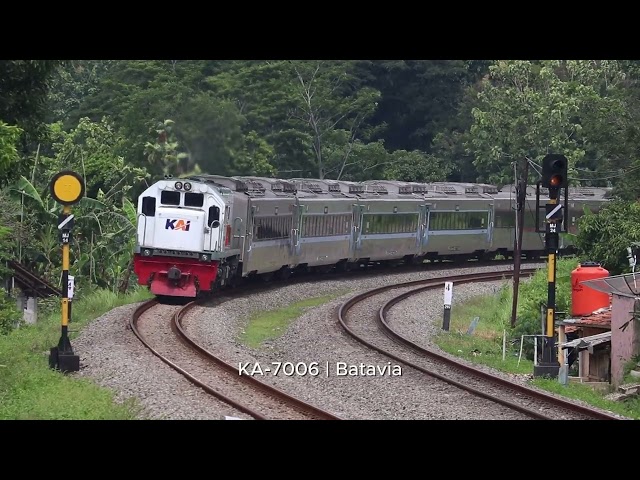 KA61 - Manahan Train and Batavia Train passing through a railroad curve