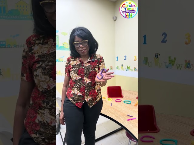 Toddlers learning early science and math concepts through sensory play with Ms Basilia.