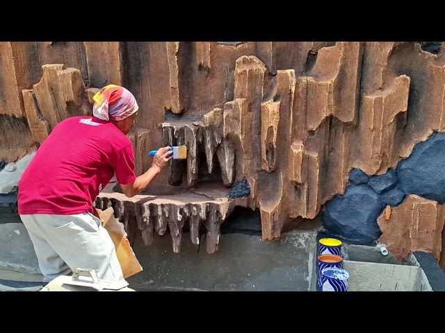 Painting the relief of the pool cliff