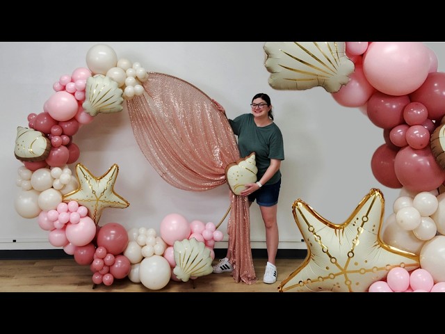 DIY Pink Balloon Arch with Draped Fabric