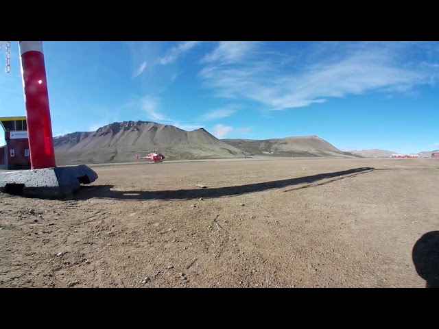 Air Greenland AS 350 helicopter taking off from constable point in North East Greenland