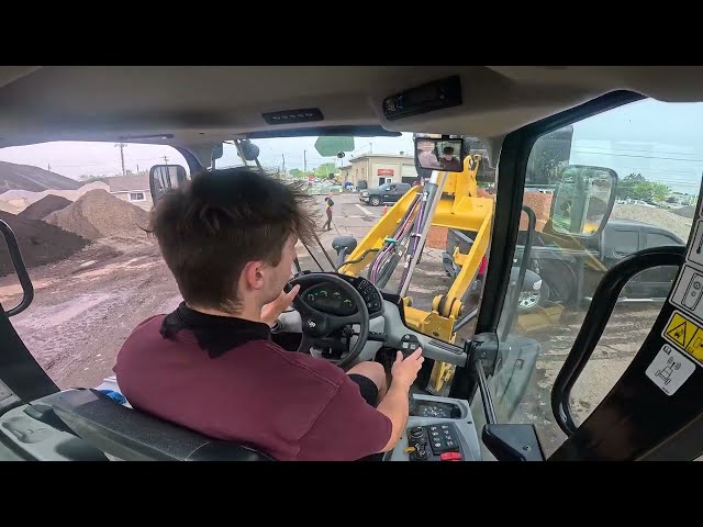 CAT 908M Wheel Loader Hard at Work Loading Trucks on a Busy Morning! - POV