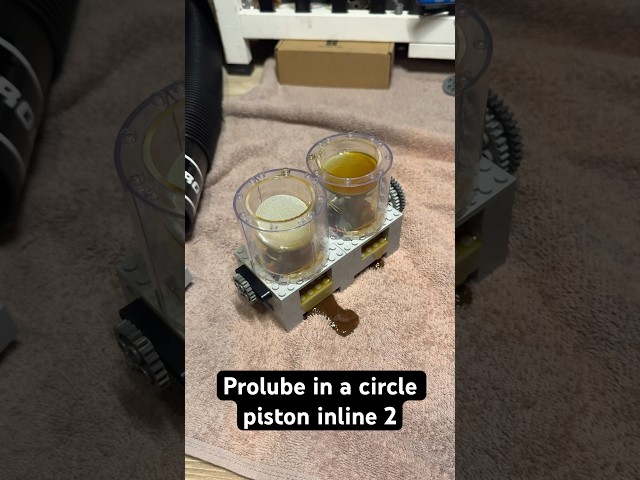 Putting pro lube oil treatment in my circle piston Lego vacuum engine ￼