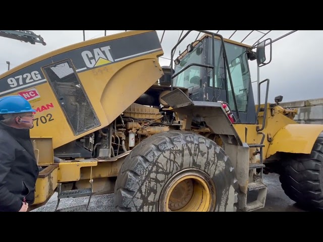 OPENING THE HOOD OF THE CAT 972G WHEEL LOADER