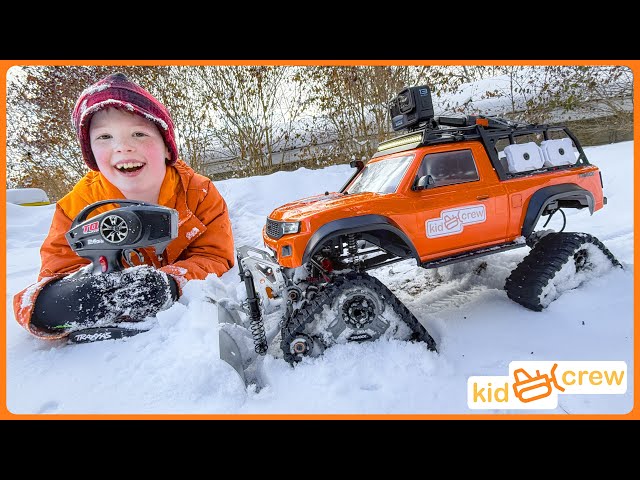 Remote controlled truck saves dad and plows snow with crawler tracks. Educational | Kid Crew