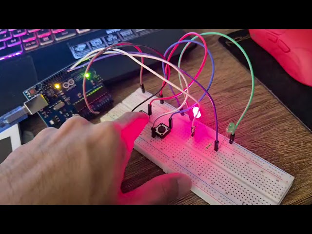 Two-Player First-to-Press Reaction Timer System Using AVR Assembly